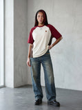 DAXUEN Loose-fit color-block raglan t-shirt with embroidered details — model photo