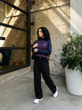 DAXUEN dark purple and olive green color-blocked long sleeve top — model photo