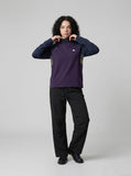 DAXUEN dark purple and olive green color-blocked long sleeve top — model photo