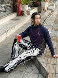 DAXUEN dark purple and olive green color-blocked long sleeve top — model photo