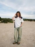 DAXUEN color-blocked t-shirt with shield patch — model photo
