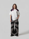 DAXUEN color-blocked t-shirt with shield patch — model photo