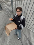 DAXUEN color-blocked track jacket with crest logo — model photo