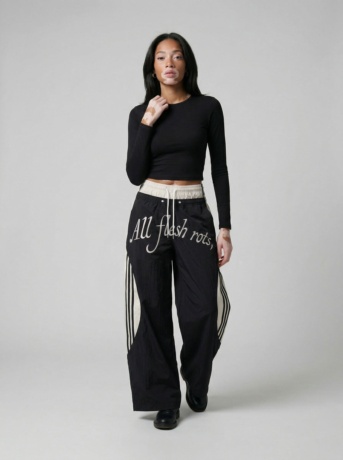 DAXUEN Color-blocked wide-leg track pants — model photo