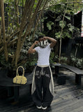 DAXUEN Color-blocked wide-leg track pants — model photo