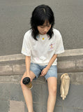 DAXUEN Embroidered short-sleeved t-shirt with colorful buttons — model photo