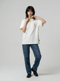 DAXUEN Embroidered short-sleeved t-shirt with colorful buttons — model photo