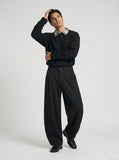 DAXUEN Loose-fitting wide-leg trousers in black and light beige — model photo