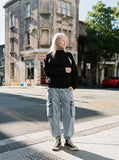 DAXUEN beige and black contrast panel bomber jacket — model photo