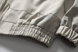 DAXUEN beige and black contrast panel bomber jacket