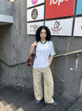 DAXUEN khaki wide-leg contrast-stitched pants — model photo