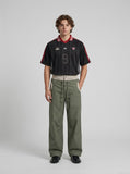 DAXUEN olive green wide-leg utility pants with contrasting waistband — model photo