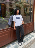 DAXUEN light beige oversized bold graphic t-shirt — model photo