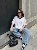 DAXUEN white and navy contrasting piped V-neck polo shirt — model photo
