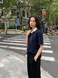 DAXUEN white and navy contrasting piped V-neck polo shirt — model photo