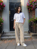 DAXUEN white and navy contrasting piped V-neck polo shirt — model photo