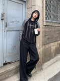 DAXUEN solid colour contrasting textured sleeve long-sleeve top — model photo