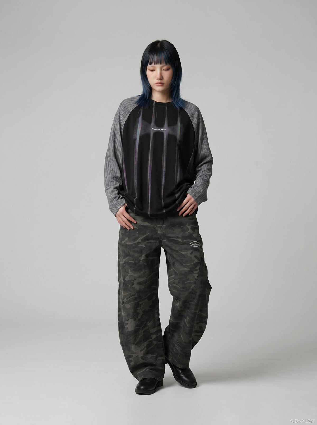 DAXUEN solid colour contrasting textured sleeve long-sleeve top — model photo