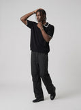 DAXUEN black contrasting trim knit polo shirt — model photo