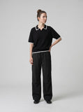 DAXUEN black contrasting trim knit polo shirt — model photo