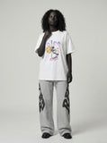 DAXUEN Oversized short-sleeve t-shirt with astronaut graphic — model photo