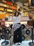 DAXUEN Cowl neck long sleeve top with layered design — model photo