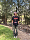 DAXUEN black oversized cracked-number trophy graphic tee — model photo