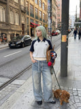 DAXUEN light blue distressed wide-leg denim jeans with cream ribbed waistband — model photo