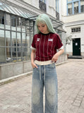 DAXUEN light blue distressed wide-leg denim jeans with cream ribbed waistband — model photo