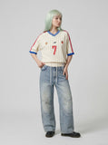 DAXUEN light blue distressed wide-leg denim jeans with cream ribbed waistband — model photo