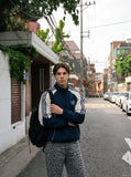 DAXUEN navy color block embroidered crest track jacket — model photo