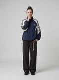 DAXUEN navy color block embroidered crest track jacket — model photo