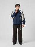 DAXUEN navy color block embroidered crest track jacket — model photo