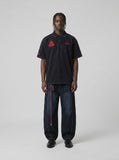 DAXUEN Men's loose-fitting polo shirt with red embroidery — model photo