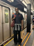 DAXUEN Men's loose-fitting polo shirt with red embroidery — model photo