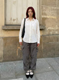 DAXUEN Crinkled long-sleeved button-up shirt — model photo