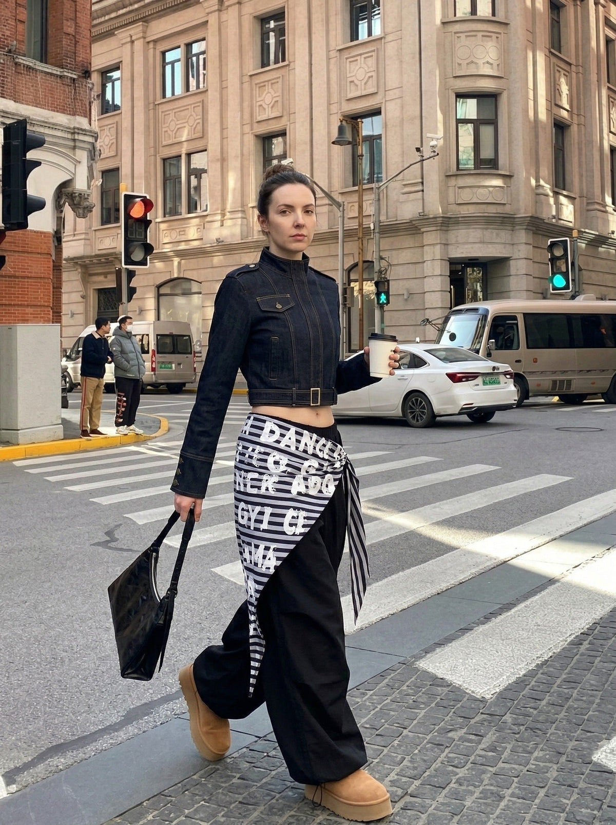 DAXUEN Cropped indigo denim jacket with gold-toned details — model photo