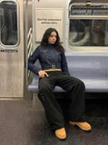 DAXUEN Cropped indigo denim jacket with gold-toned details — model photo