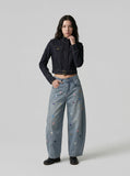 DAXUEN Cropped indigo denim jacket with gold-toned details — model photo