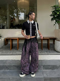 DAXUEN Cropped polka dot knit top with collar — model photo