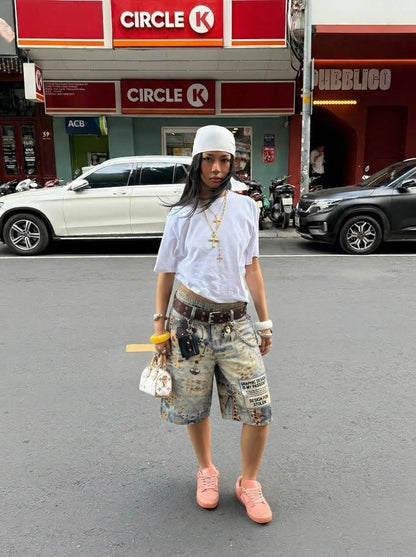 DAXUEN Cropped wide-leg digital print pants with bear graphic — model photo