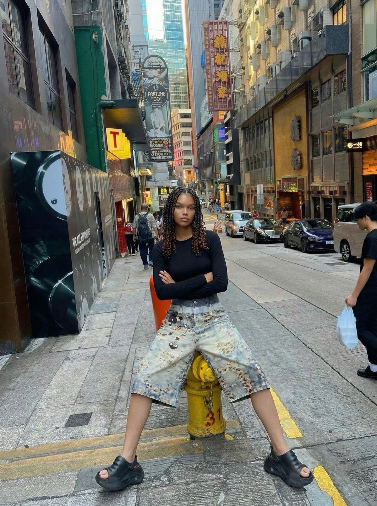 DAXUEN Cropped wide-leg digital print pants with bear graphic — model photo
