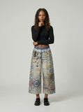DAXUEN Cropped wide-leg digital print pants with bear graphic — model photo