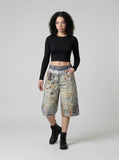 DAXUEN Cropped wide-leg digital print pants with bear graphic — model photo