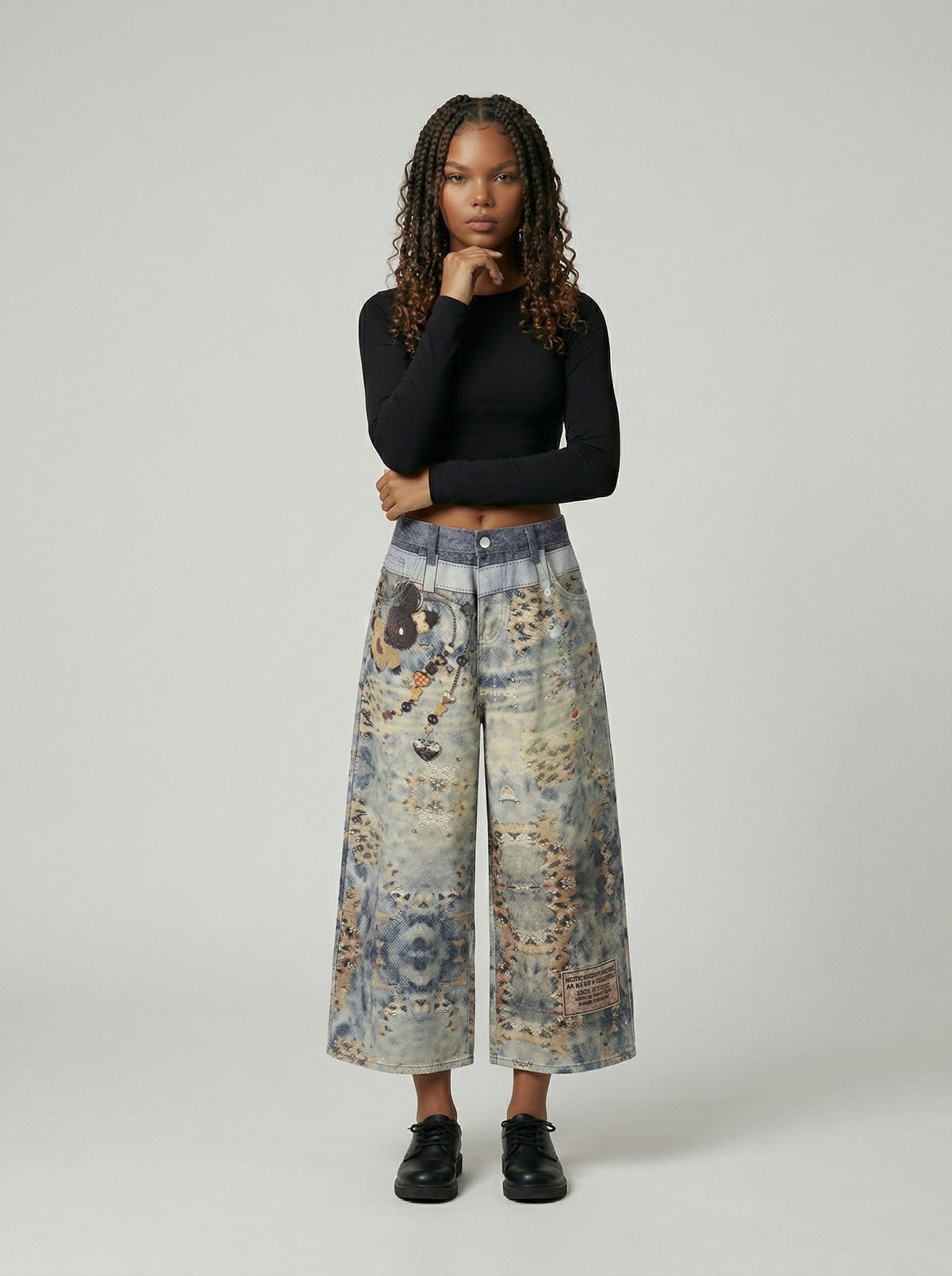 DAXUEN Cropped wide-leg digital print pants with bear graphic — model photo