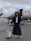 DAXUEN Cropped wide-leg trousers in black and charcoal grey — model photo