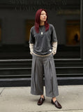 DAXUEN Cropped wide-leg trousers in medium-grey with decorative studs — model photo