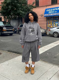 DAXUEN Cropped wide-leg trousers in medium-grey with decorative studs — model photo