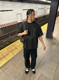DAXUEN Oversized short-sleeved t-shirt with cross embroidery — model photo