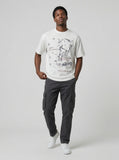 DAXUEN White short-sleeved t-shirt with abstract graphic — model photo